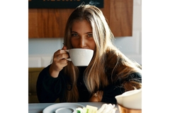 Image Woman drinking coffee.